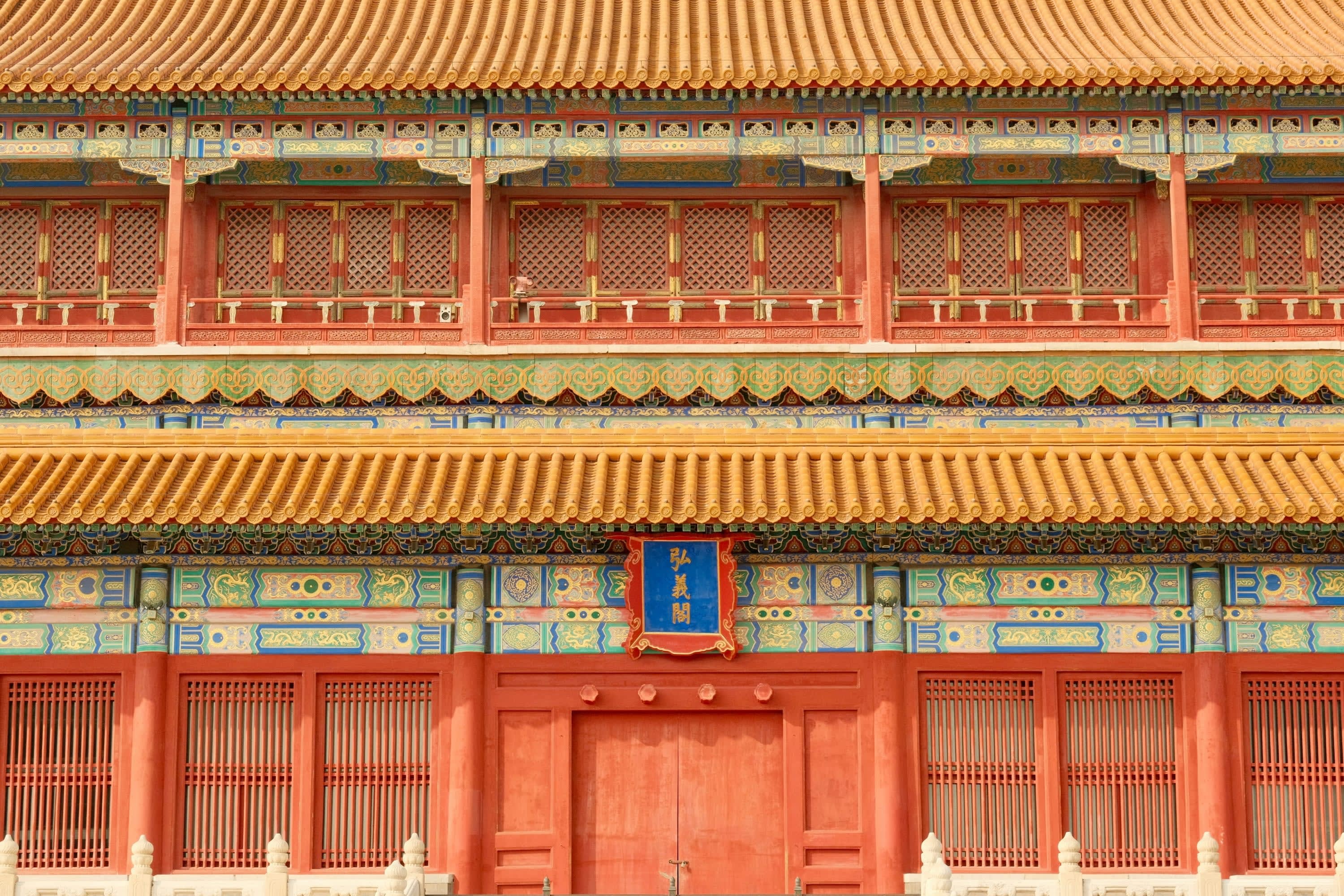 Hues of orange, blue and yellow on display in an intricately designed temple of Asian origins