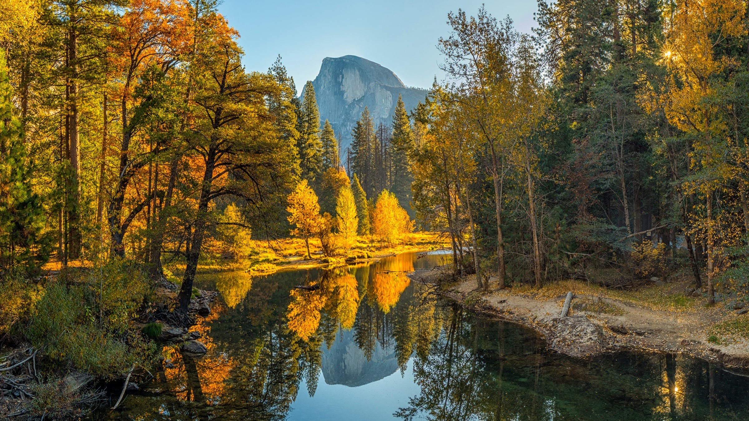 Half Dome reflected in the Merced River in Yosemite National Park during fall