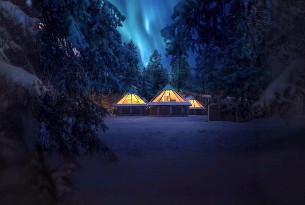 Glass-roofed aurora cabins in Finnish Lapland. Photo: Bliss Adventure.