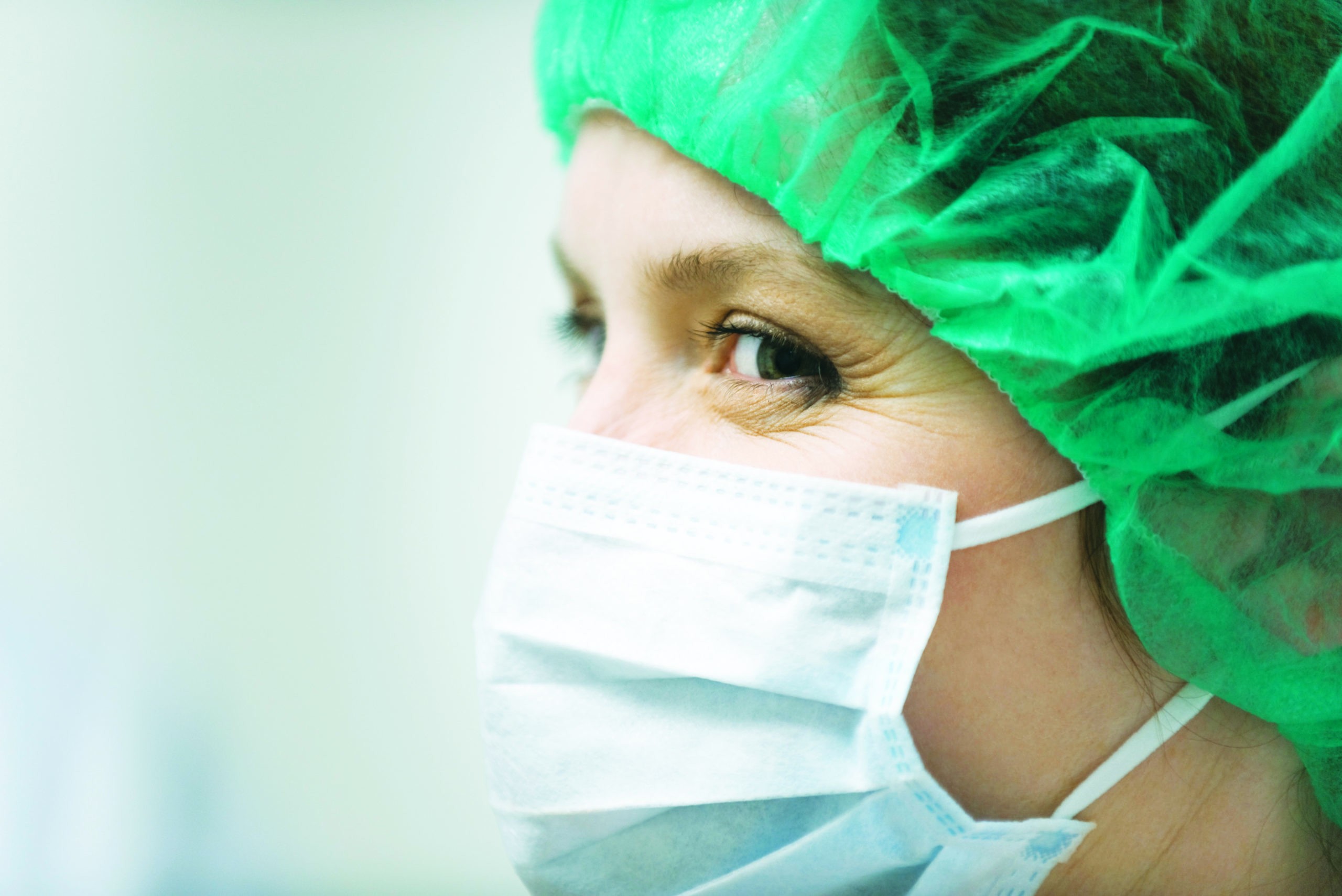 Travel scrub tech preparing surgical instruments in a hospital operating room