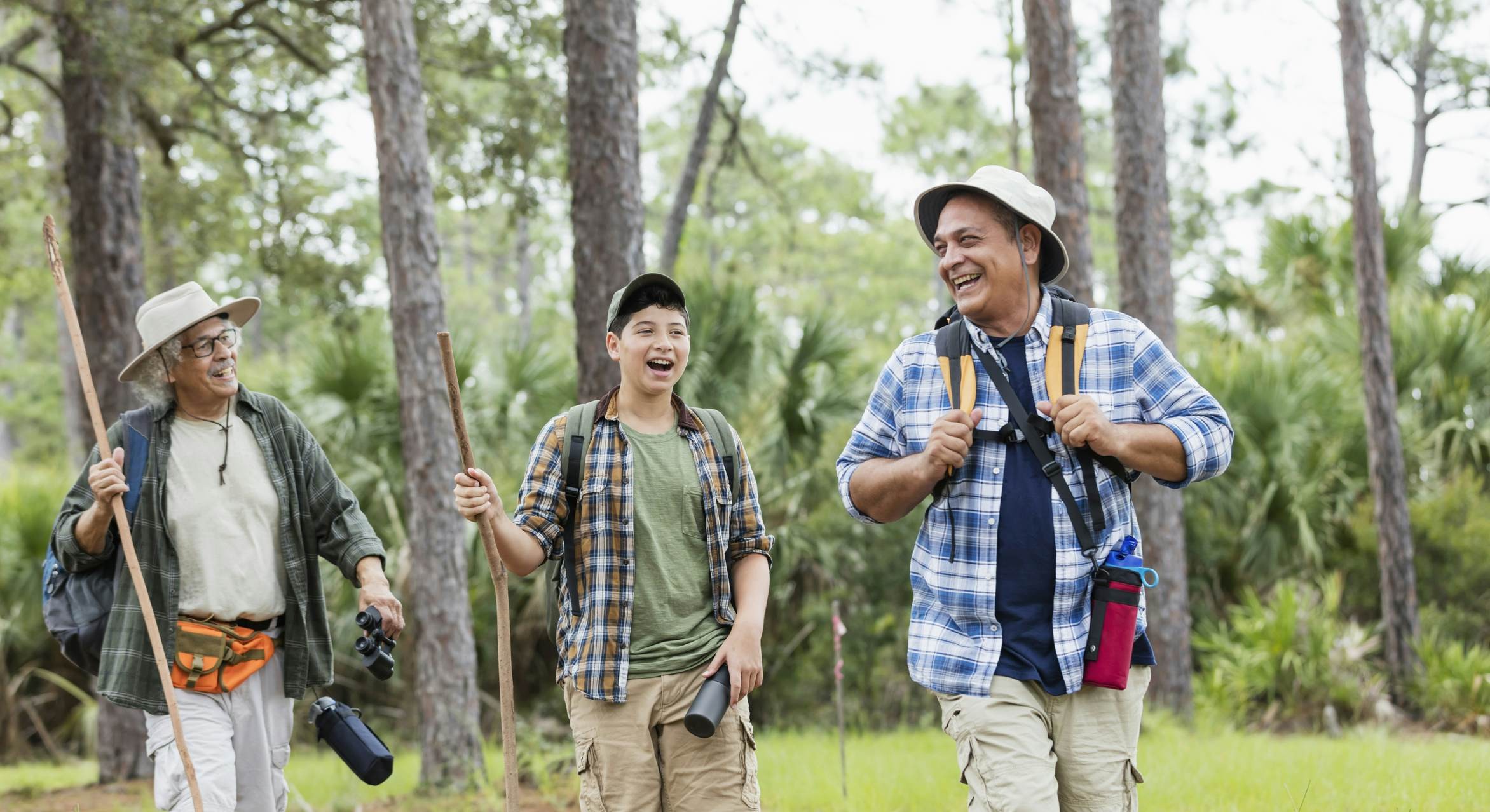 Multi-generation family hiking in Florida woods