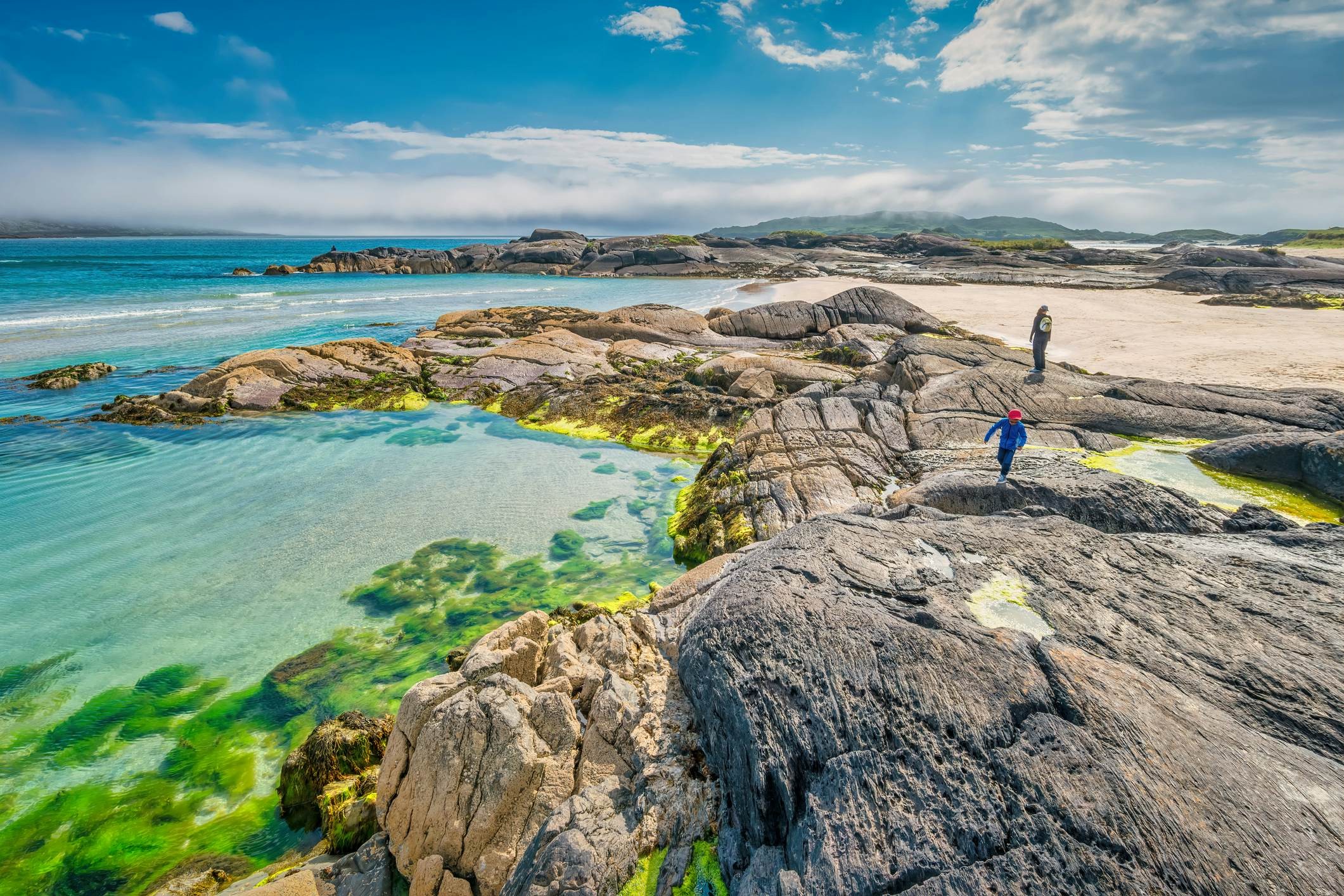 Family on the beach along Ring of Kerry, Ireland