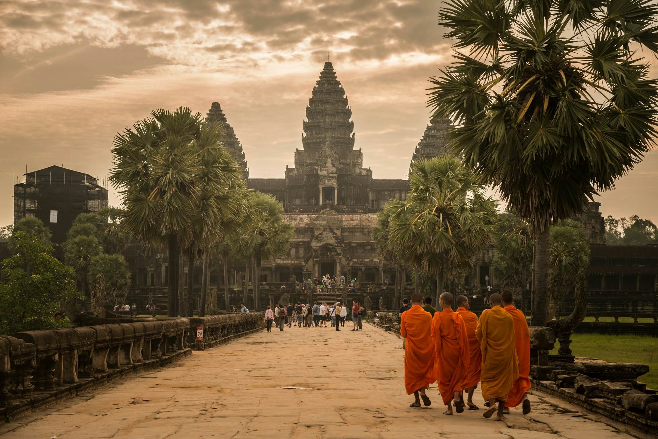 Ancient Angkor temples stand majestically near Siem Reap, Cambodia, showcasing the grandeur of Khmer architecture amidst lush greenery