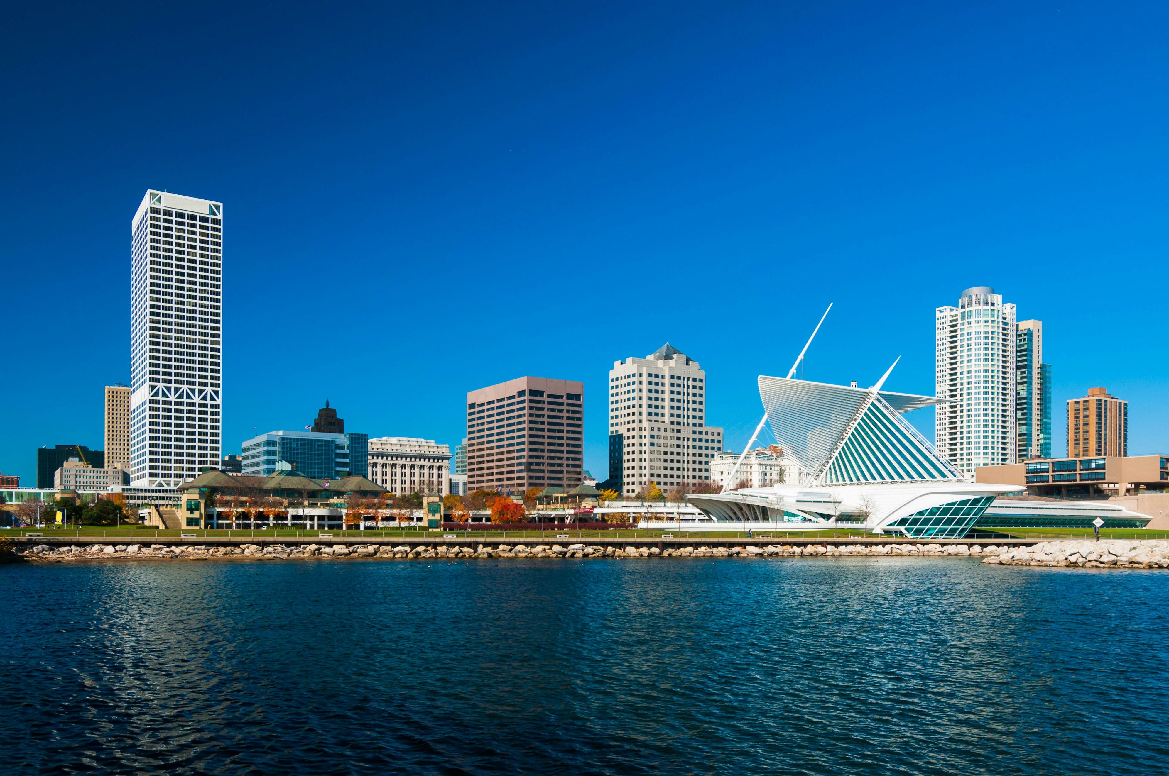 Downtown Milwaukee skyline with the Milwaukee Art Museum on the right showcasing the city's modern architecture and vibrant urban atmosphere