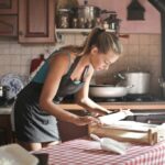 Girl happily cooking alone, highlighting the joy of solo activities