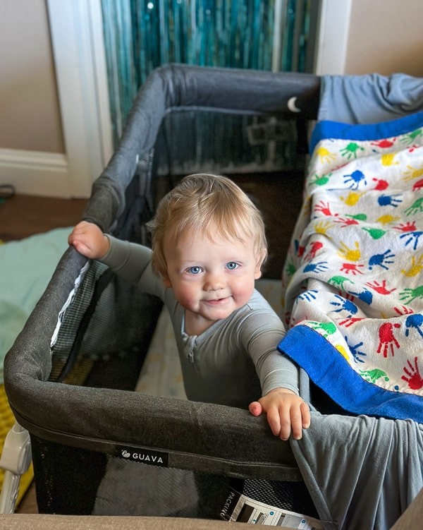 Guava lotus travel crib setup in a room