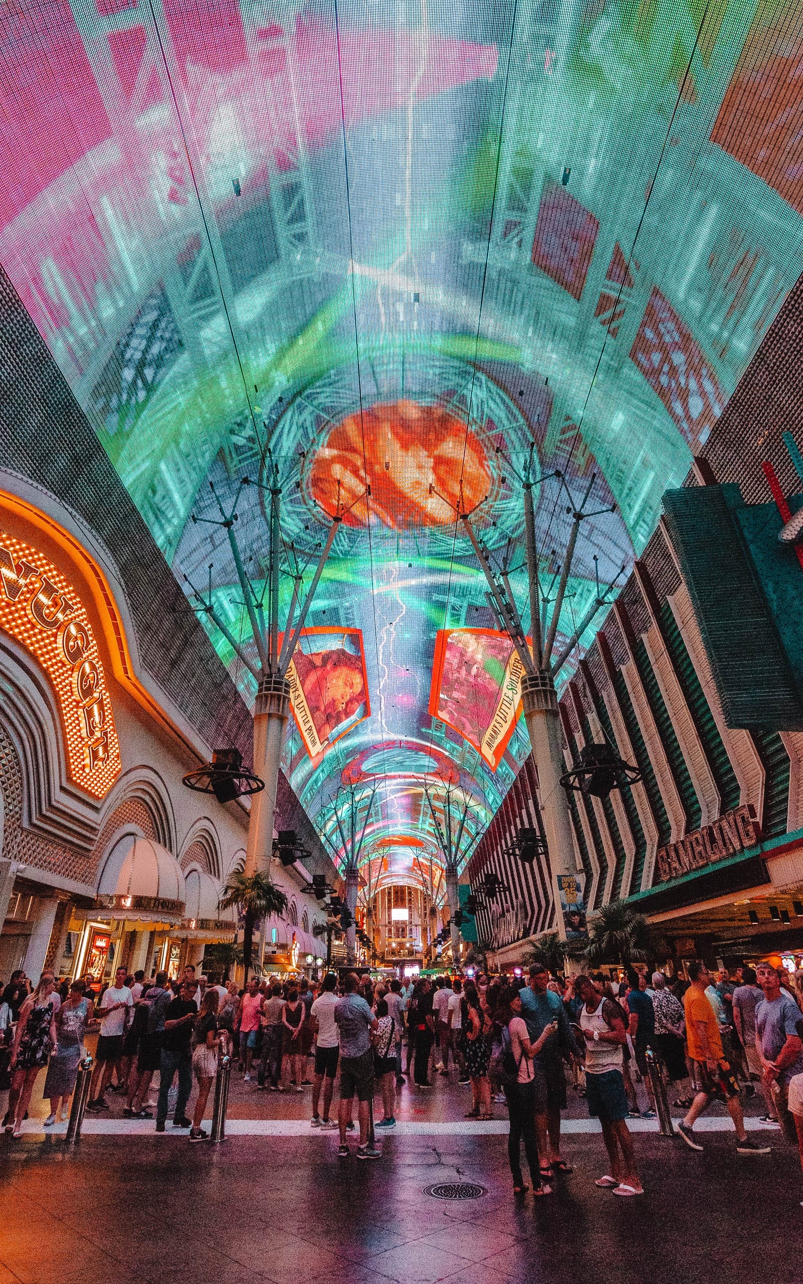 Inside a bustling casino in Las Vegas with slot machines and gaming tables, showcasing the gambling aspect of nevada travel destinations