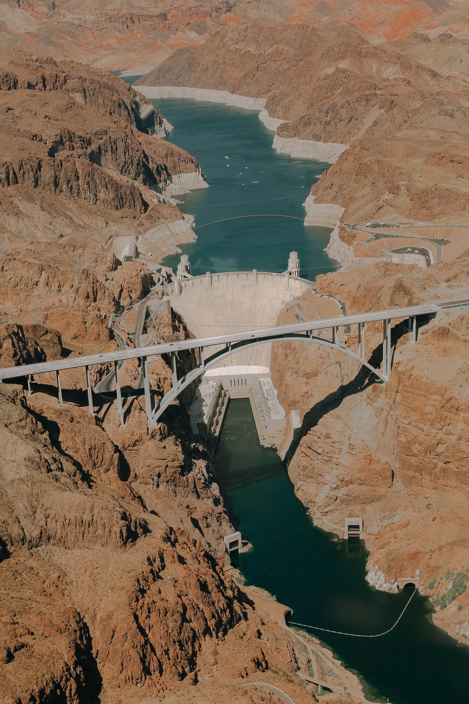 The Hoover Dam towering over the Colorado River and Lake Mead, showcasing the engineering marvel of nevada travel destinations