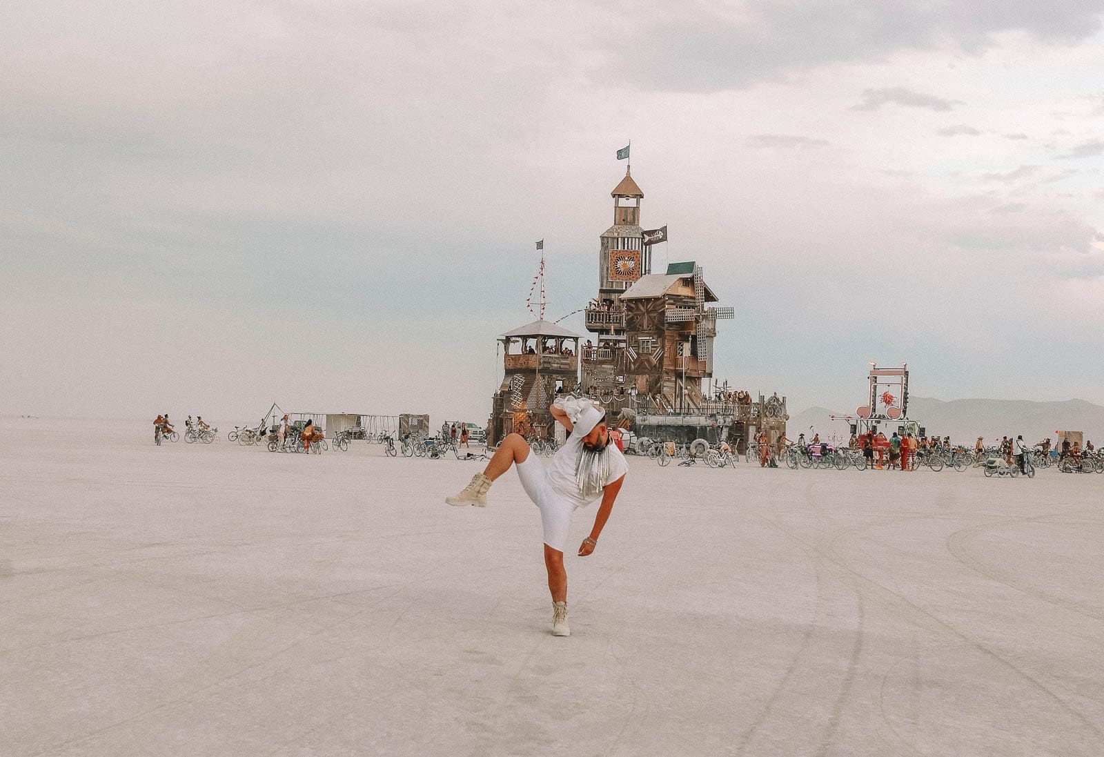 A decorated art car driving through Black Rock City, showcasing the mobile art and unique culture of nevada travel destinations