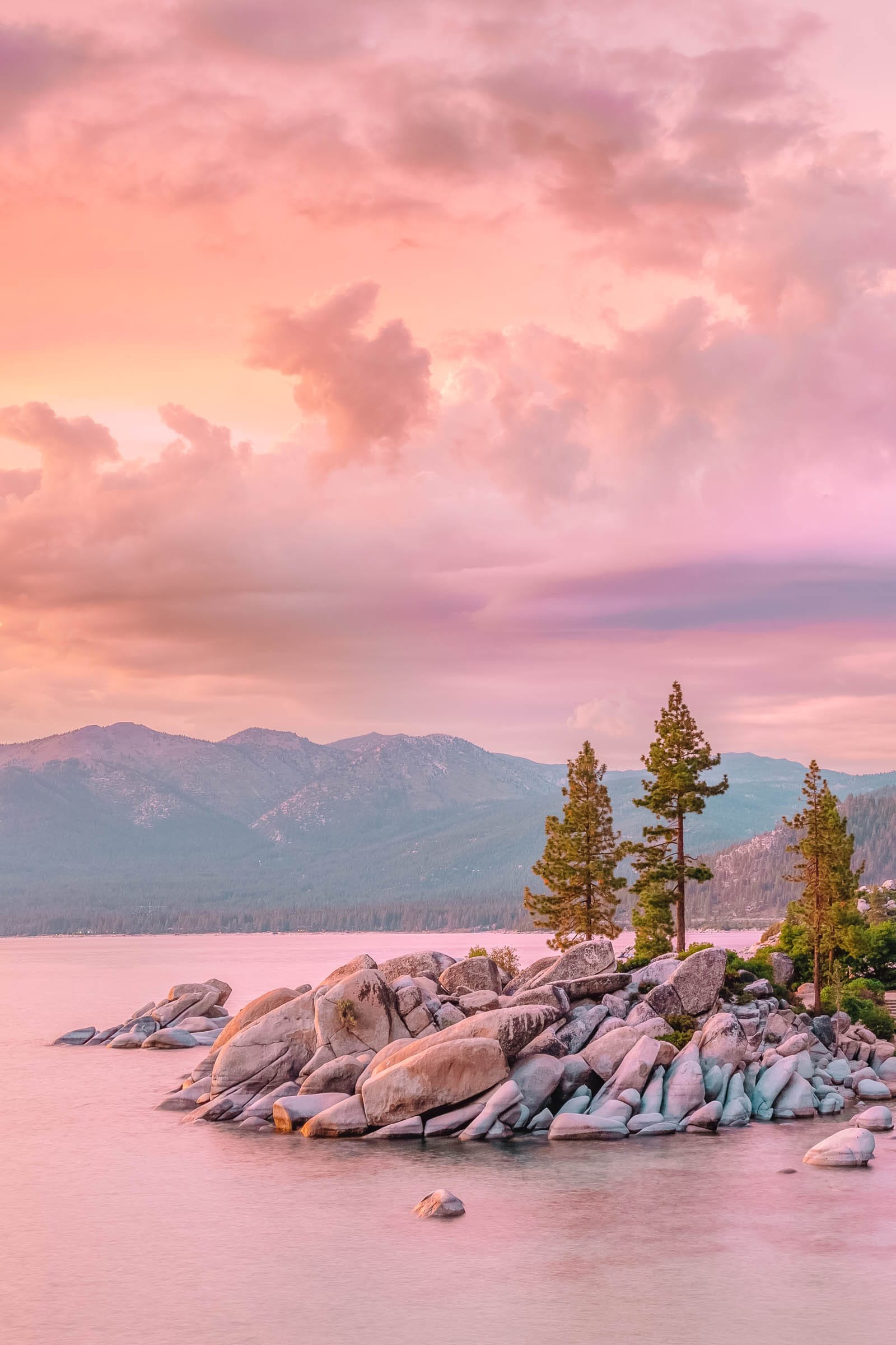 Kayaks and paddleboards on the calm waters of Lake Tahoe, highlighting water sports in nevada travel destinations