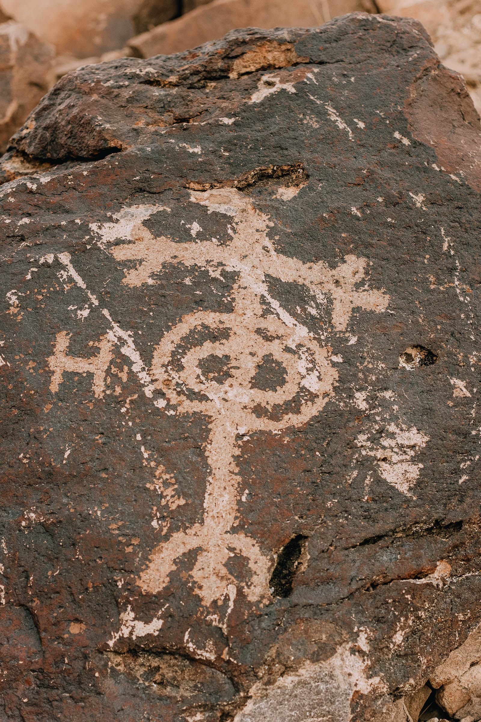 Native American petroglyphs etched on rocks in Sloan Canyon, highlighting the cultural heritage of nevada travel destinations