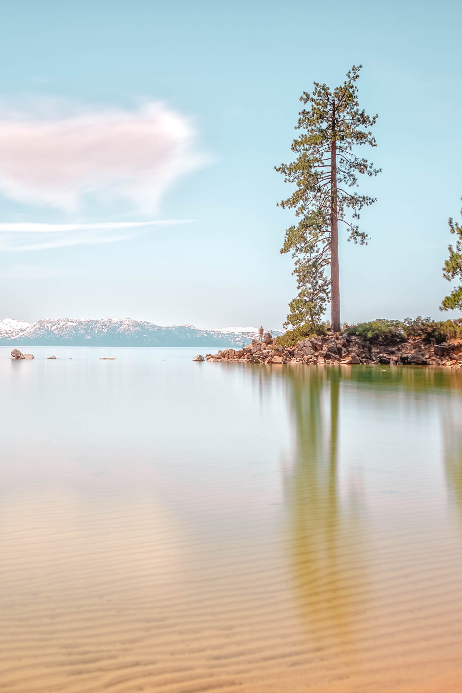 A sandy beach along the shore of Lake Tahoe, perfect for summer activities in nevada travel destinations