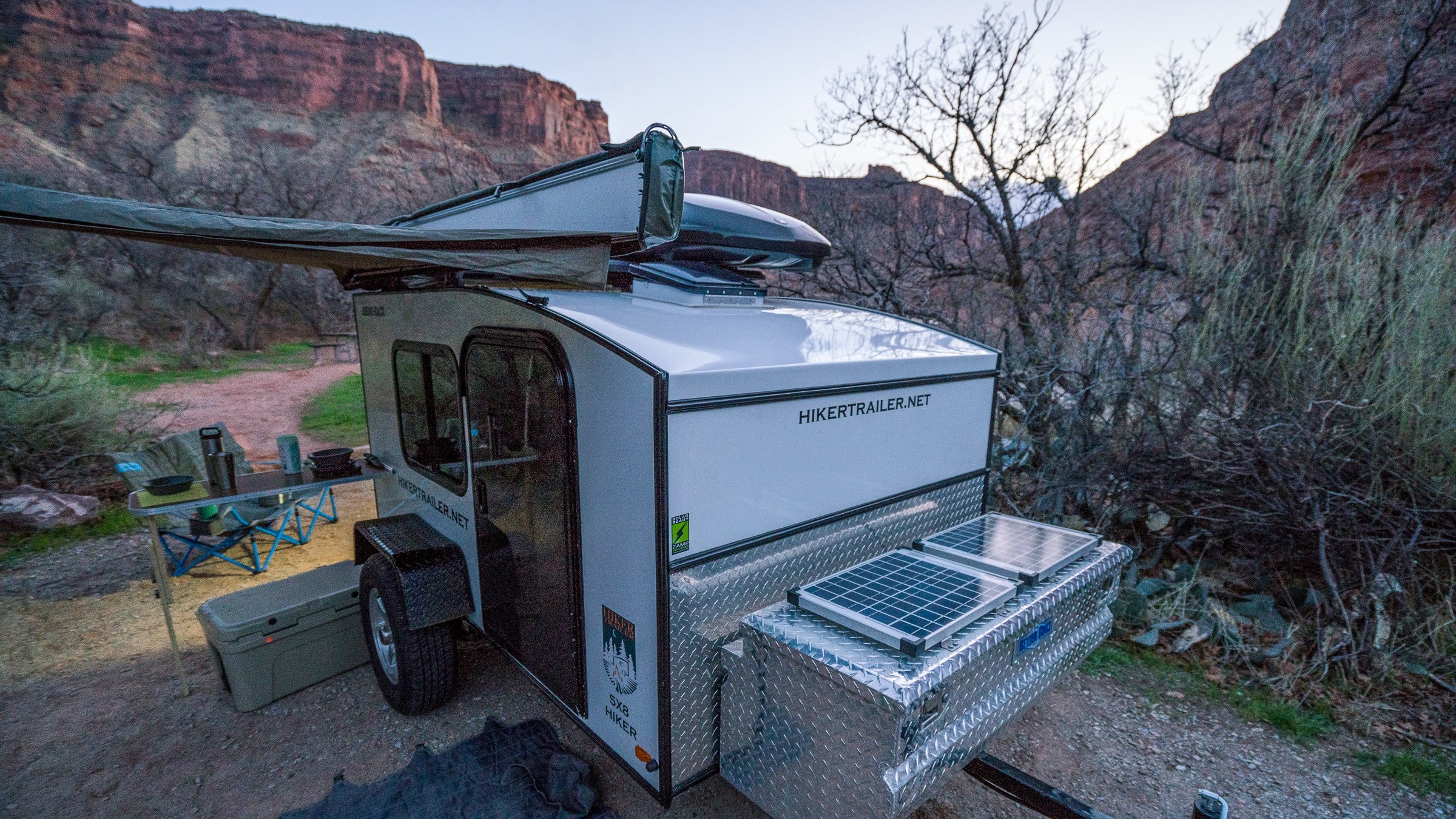 The Hiker Trailer exterior included solar panels and a Rhino Rack awning system, enhancing its off-grid capabilities.