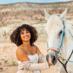 Woman with curly hair in Cappadocia, Turkey, showcasing natural travel hair