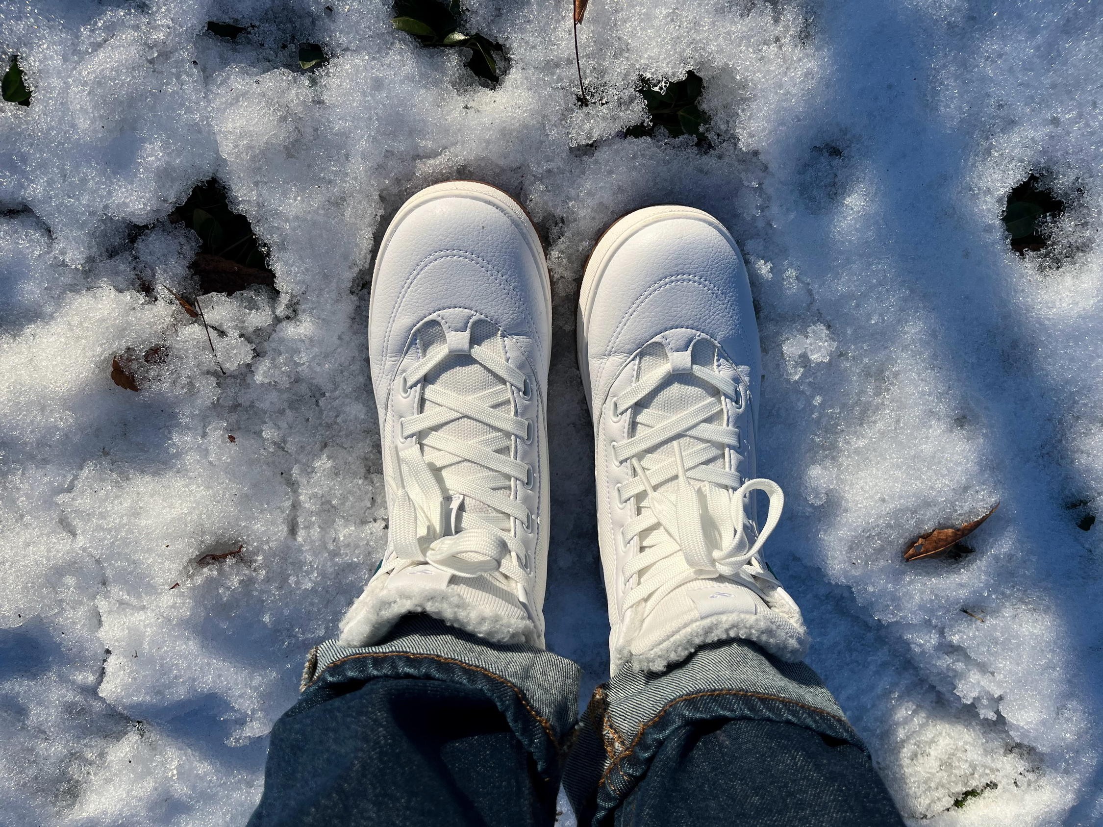 Close-up of couple wearing Vessi Weekend Chelsea waterproof travel boots showcasing style.