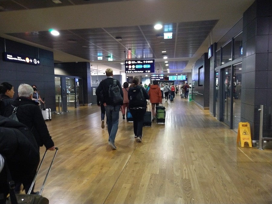 Signage inside Reykjavik-Keflavik Airport directing to arrivals