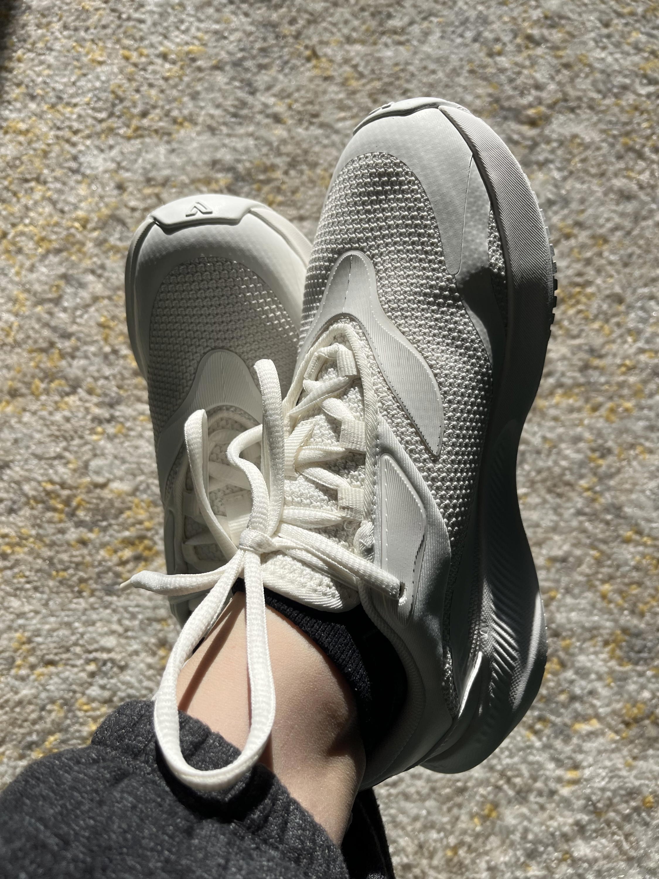 Side view of woman wearing Vessi Tidal waterproof travel sneakers highlighting the design.