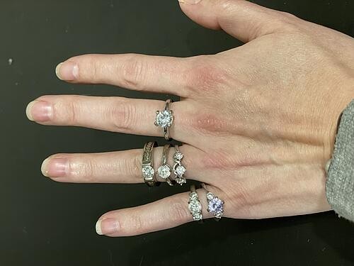 Selection of vacation rings alongside a real diamond ring