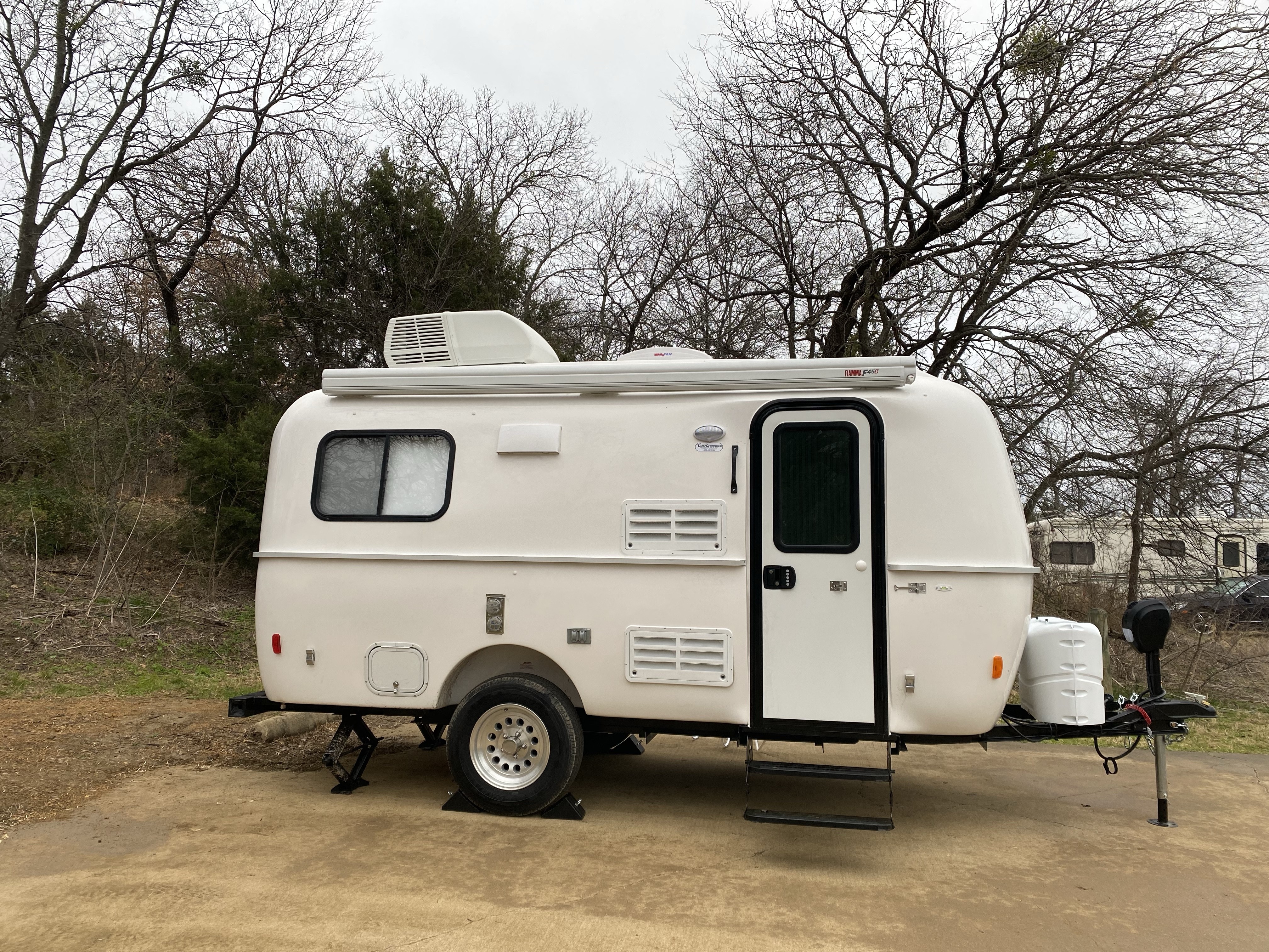 Close-up of the fiberglass shell of a Casita travel trailer, highlighting its seamless construction and durability.