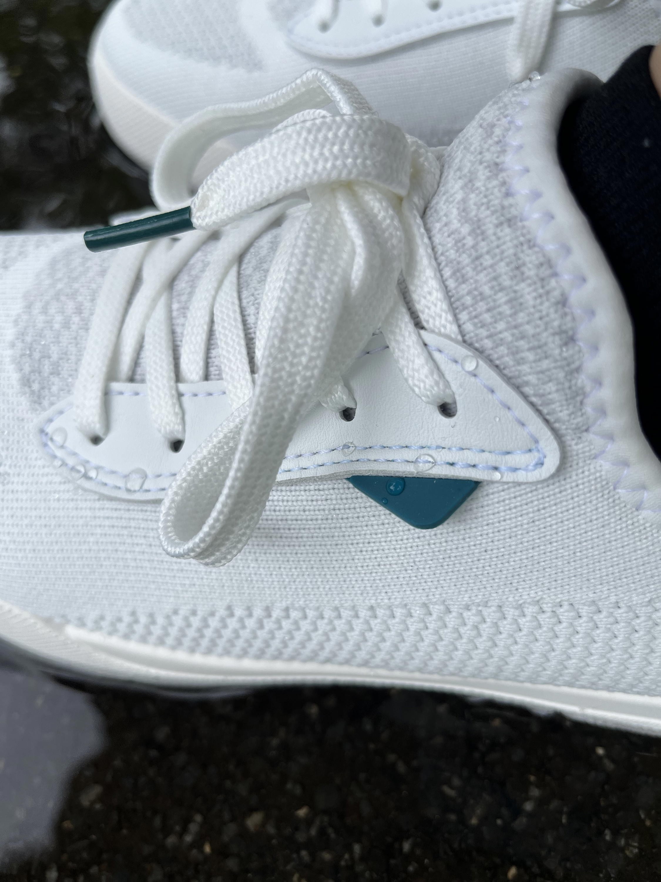 Angle view of Vessi Weekend waterproof sneakers showing water-resistant material.