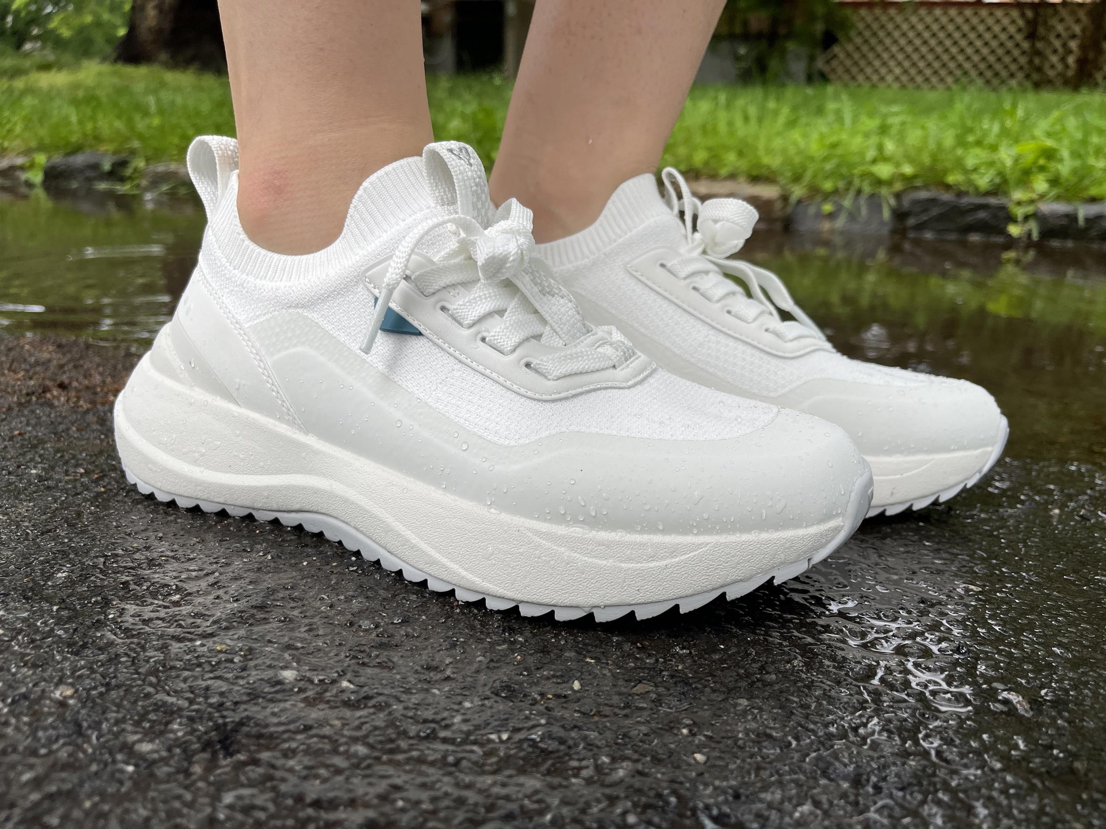 Close-up of Vessi Stormburst waterproof travel sneaker in white showcasing design and material.