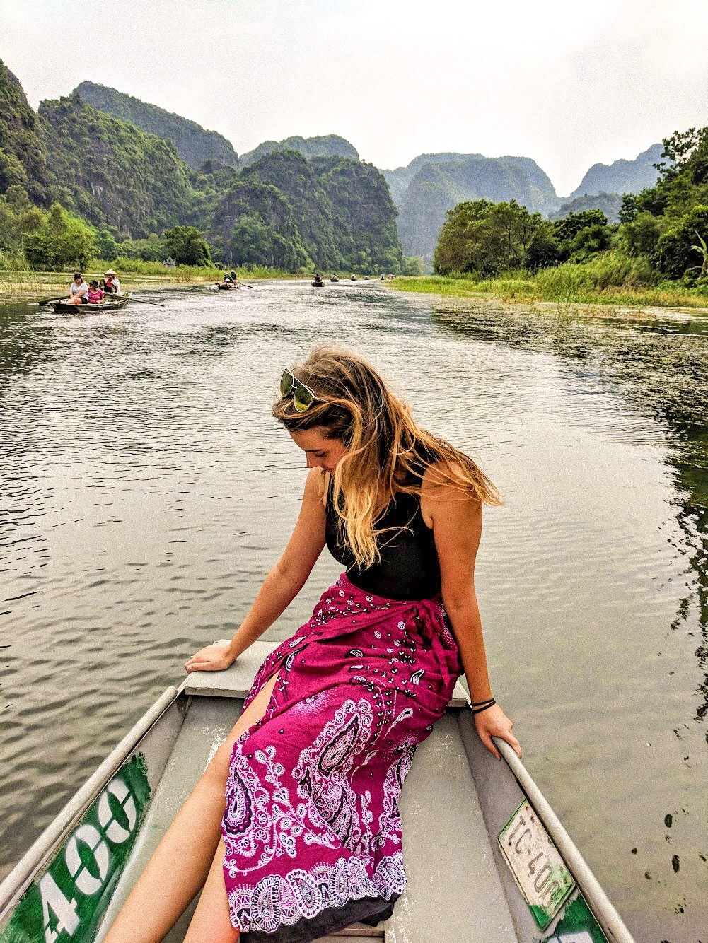 Rowing through the scenic Tam Coc in Ninh Binh, often called &quot;Halong Bay on Land&quot;