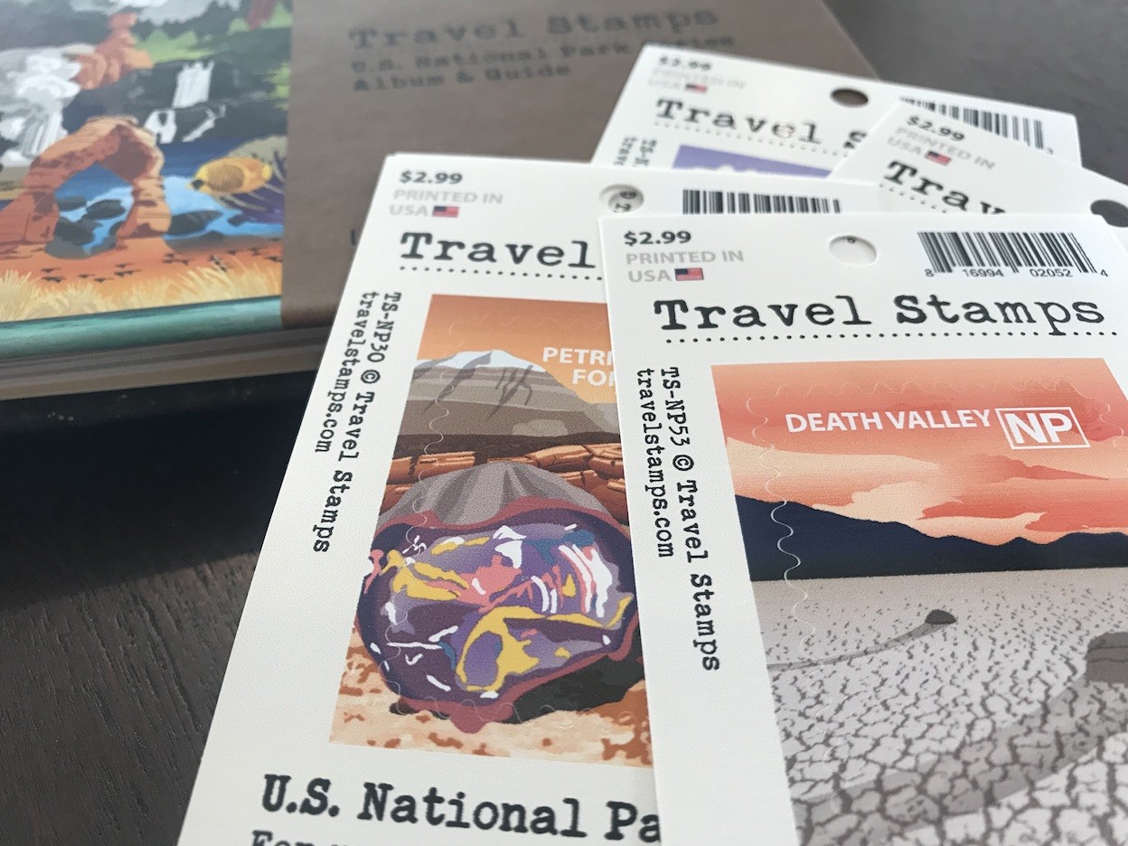 Travel Stamps U.S. National Parks Album &amp; Guide showcasing colored pages and premium design elements