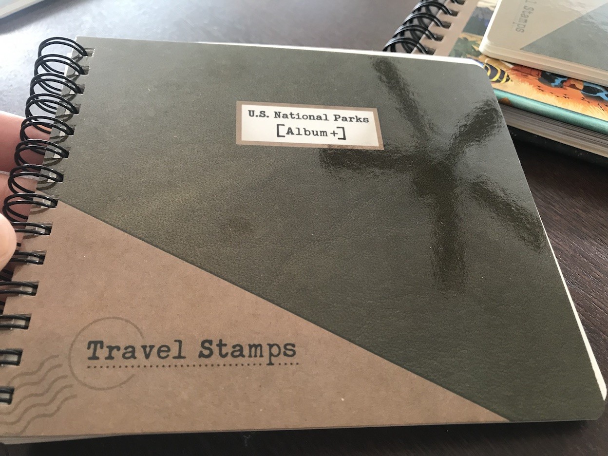 Travel Stamp U.S. National Park Album cover with park names and minimalist design