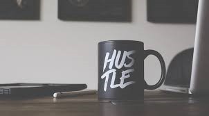 mug with word hustle