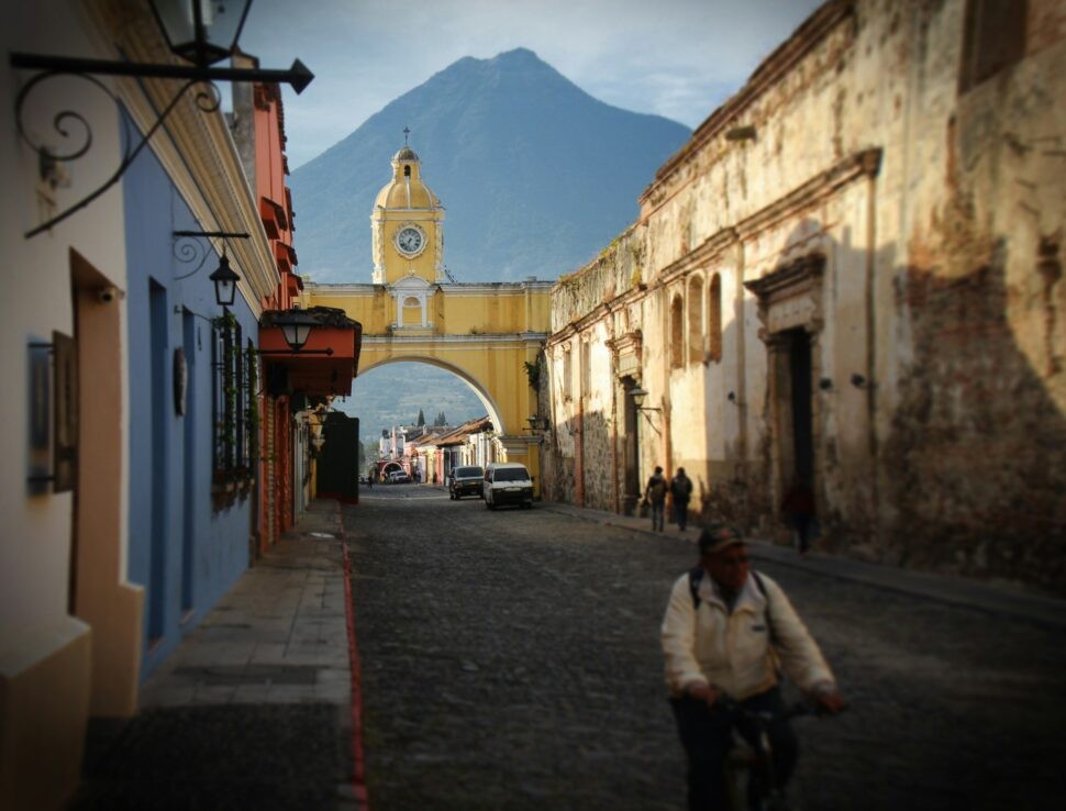 Majestic mountain backdrop behind the colorful architecture of Antigua, Guatemala