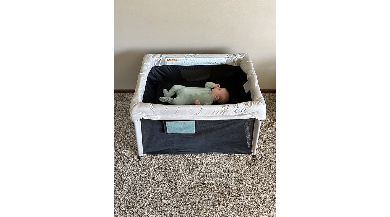 Jennifer W. testing the Silver Cross Sleep & Go travel crib, highlighting its ease of setup and portability.