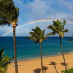 A rainbow above the golden sands of Maui