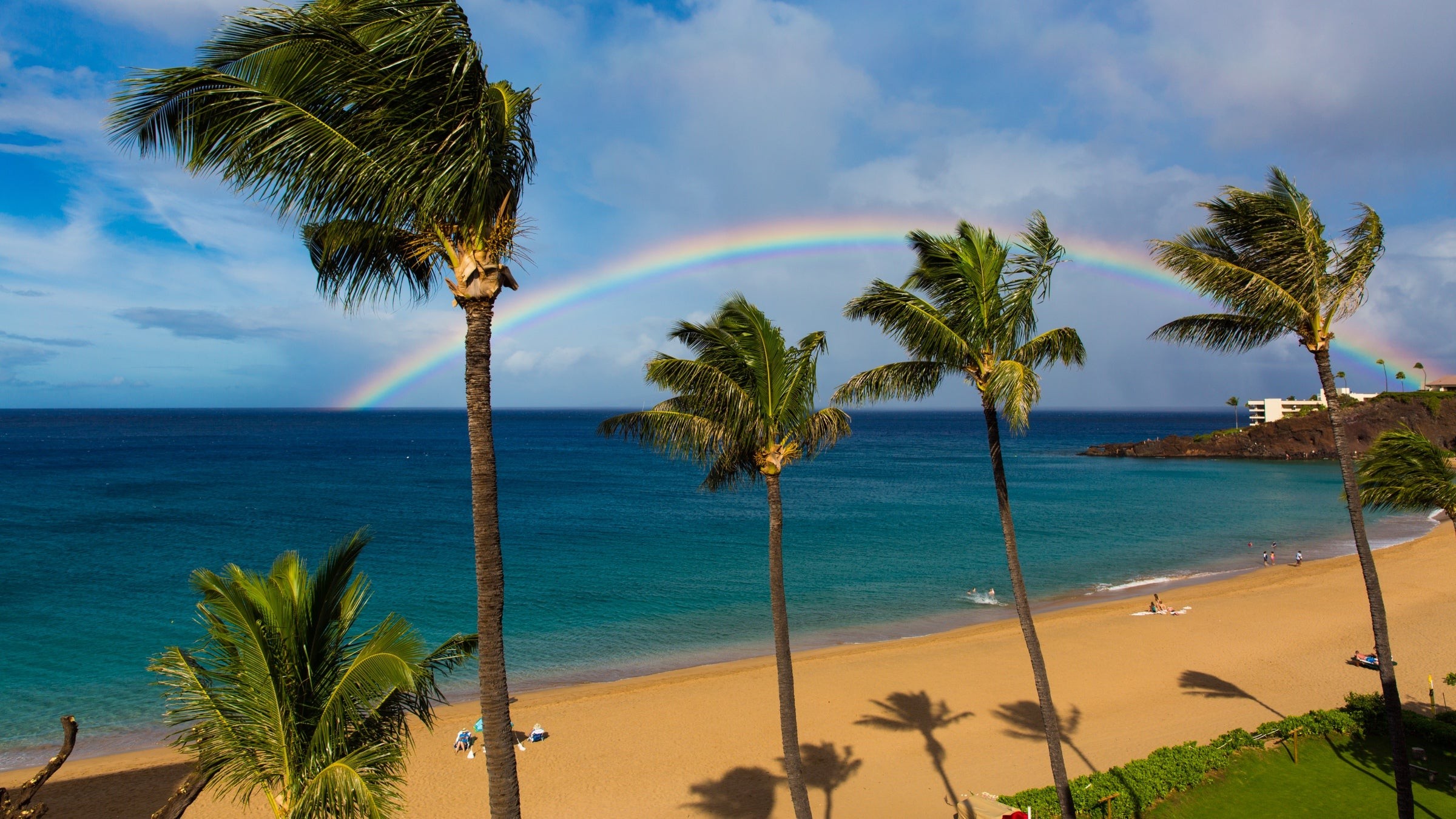 A rainbow above the golden sands of Maui