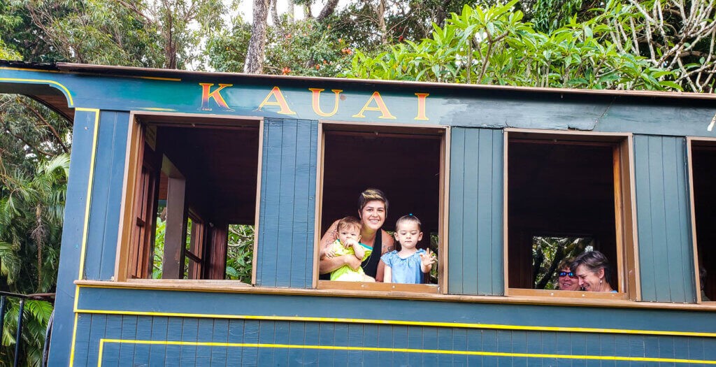 family on train at plantation in kauai