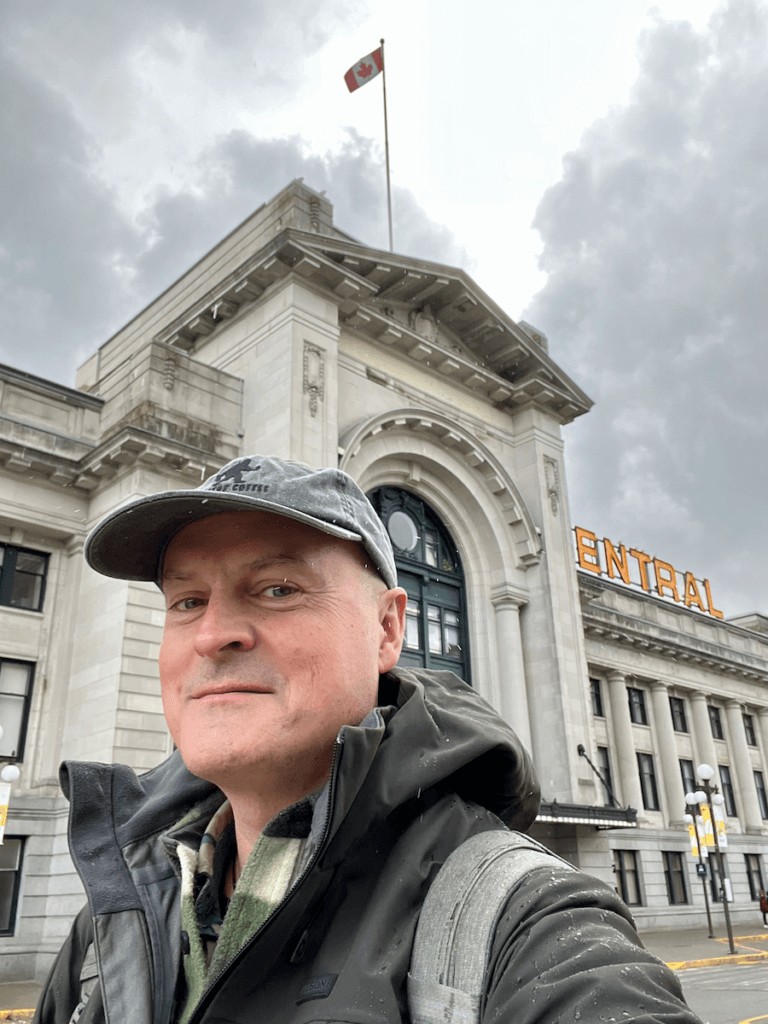 Matthew Kessi in front of Pacific Central Station in Vancouver, Canada, marking the starting point for train journeys south to Seattle.