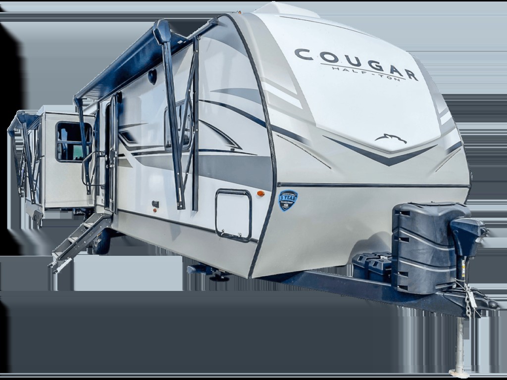 alt text: The Keystone Cougar 33RLI travel trailer showcases a spacious interior with washer and dryer prep, blending comfort and convenience for extended travels.