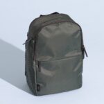 July Carry All Backpack Series 2 showcasing its stylish design and leather accents, ideal for professional work travel.