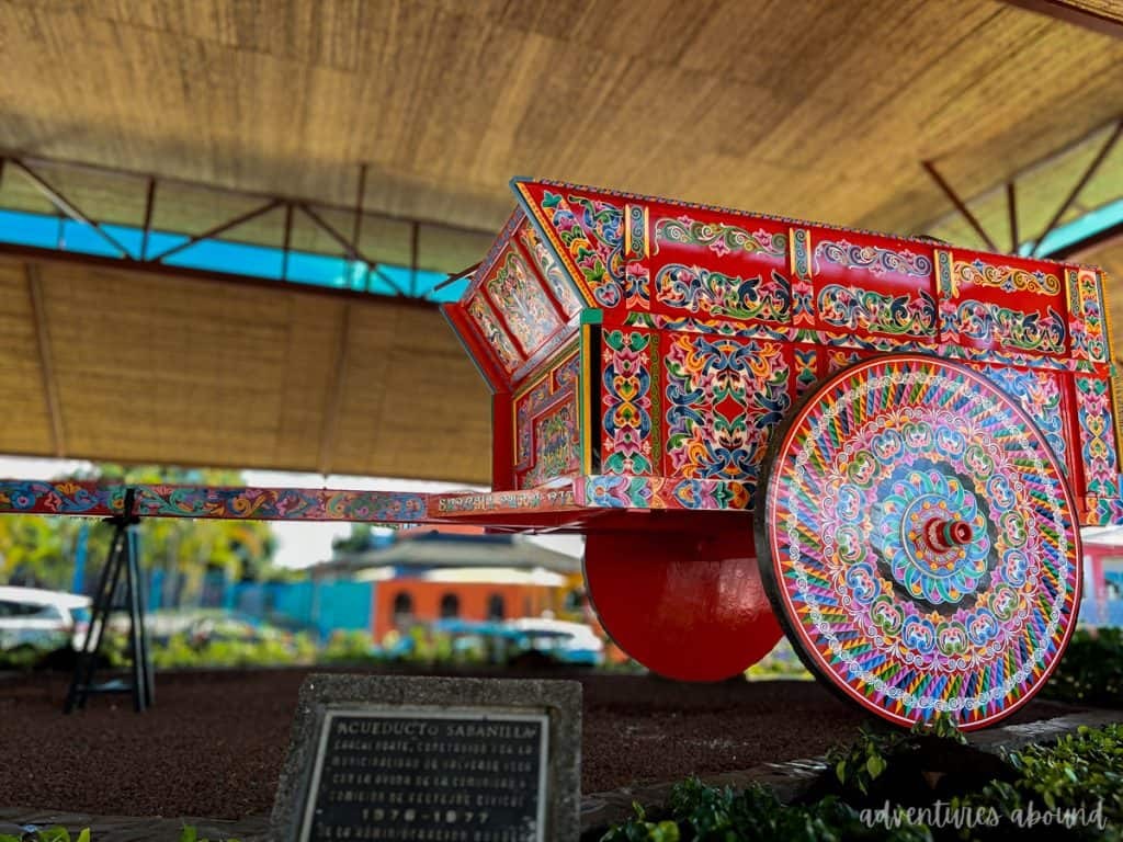 An ornately-decorated colorful hand-painted oxcart. 