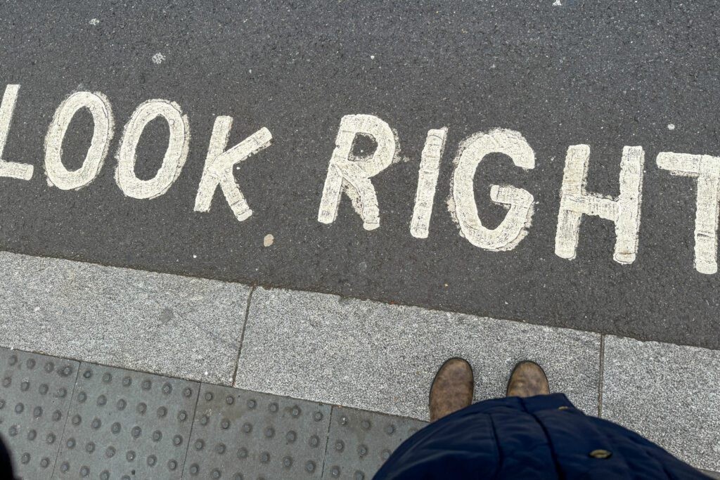 A &quot;Look Right&quot; street sign painted on a London road, reminding pedestrians to check for traffic coming from the right