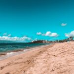 Woman looking at the ocean on a beach in Maui