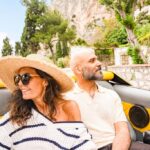 Couple enjoying a convertible ride in Capri, Italy, showcasing a luxurious and romantic travel experience