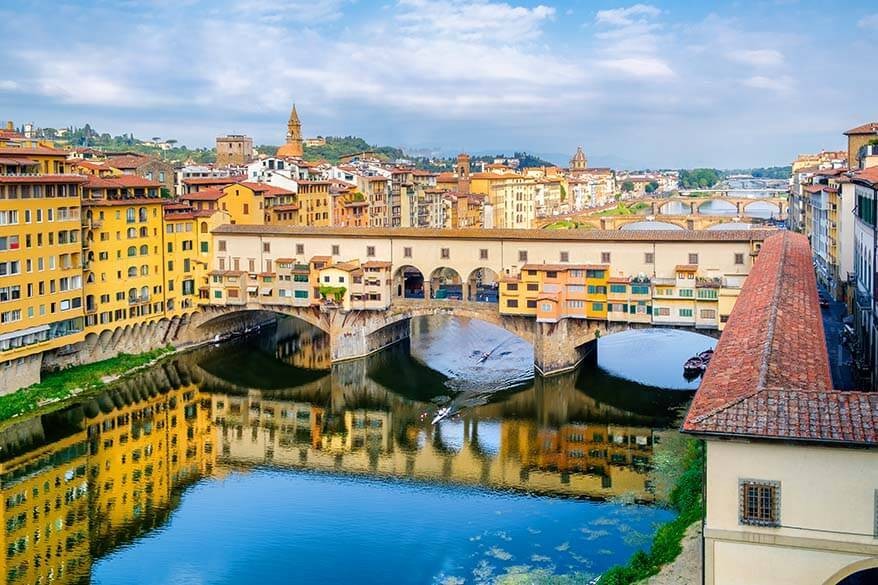 Ponte Vecchio and Florence bridges reflecting in the Arno River, Italy