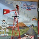 Mural art depicting Route 66 and vintage cars at Russell's Truck & Travel Center