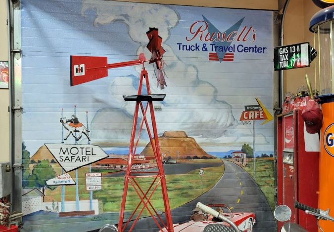 Mural art depicting Route 66 and vintage cars at Russell's Truck & Travel Center