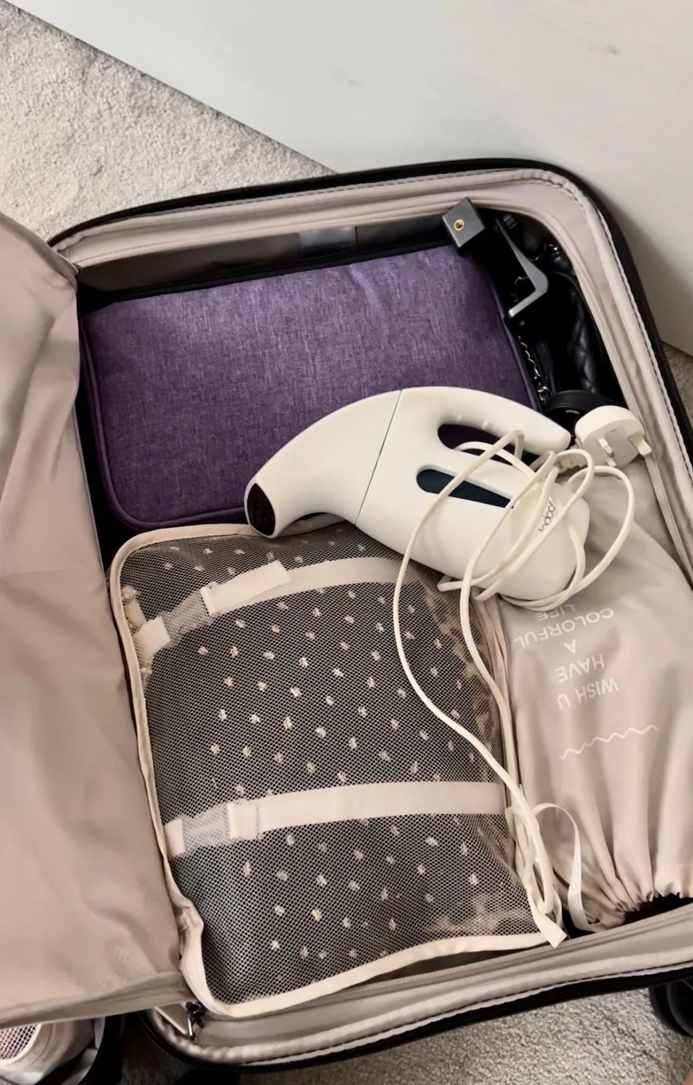 The author's trusty travel steamer, a frequently used and convenient wrinkle-removal tool