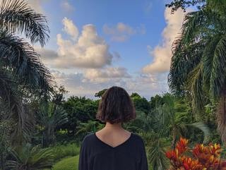 A woman immersed in the vibrant green jungle of the Dominican Republic