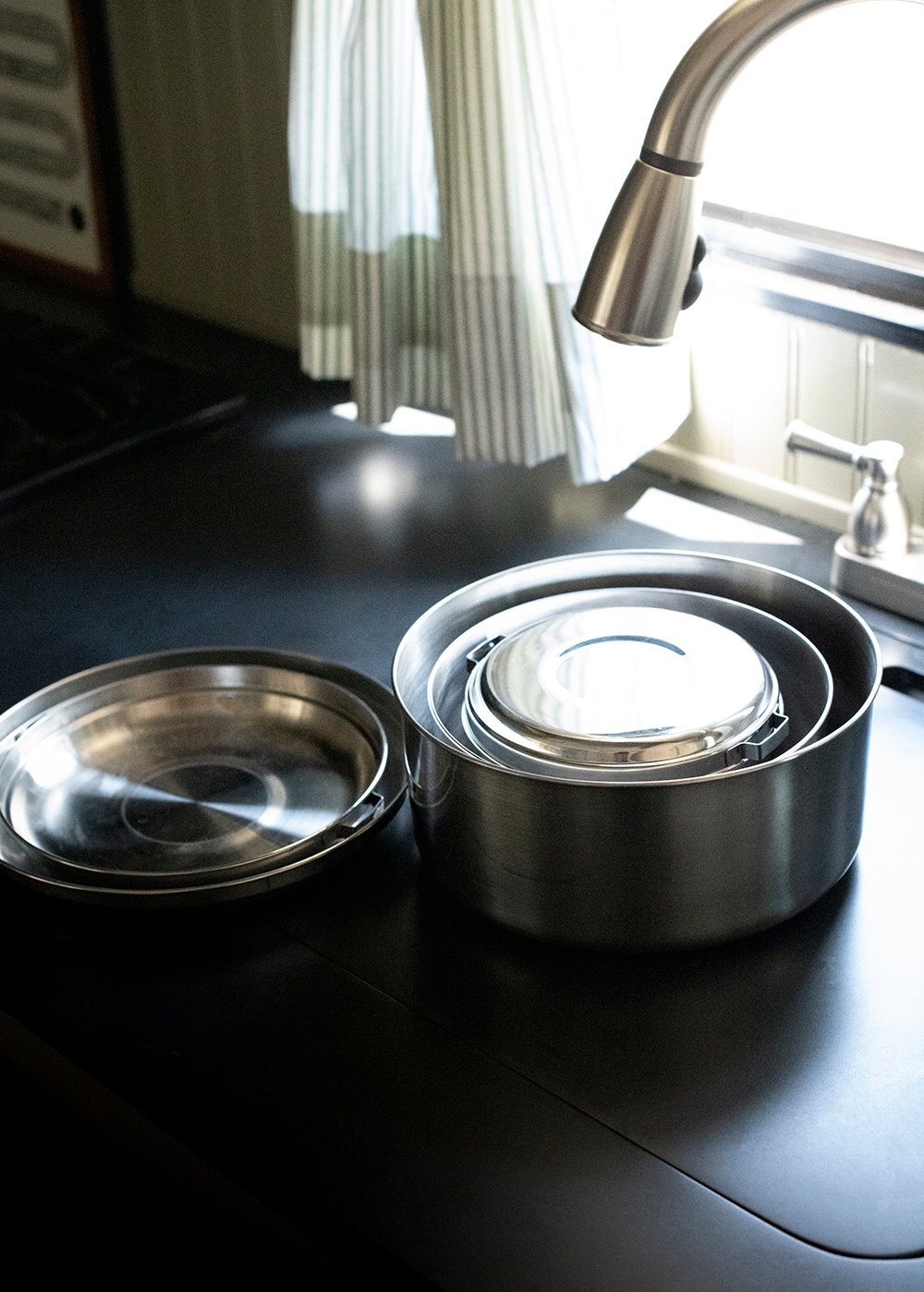 Nesting camping cookware for space-saving in camper kitchen