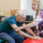 Elderly patient receiving physical therapy, highlighting patient care in travel PT