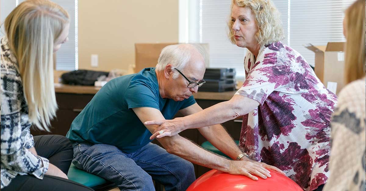 Elderly patient receiving physical therapy, highlighting patient care in travel PT