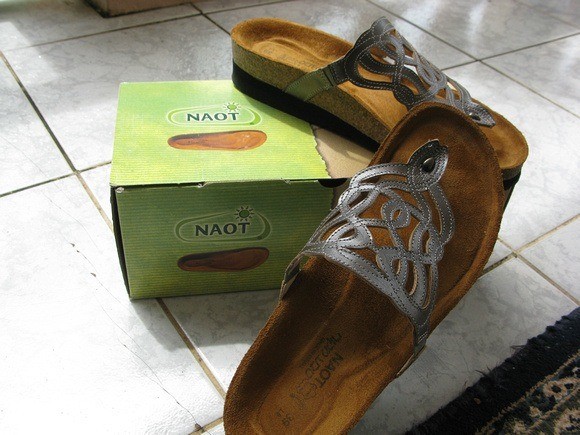 Naot sandals, showcasing their supportive footbed ideal for comfortable walking.